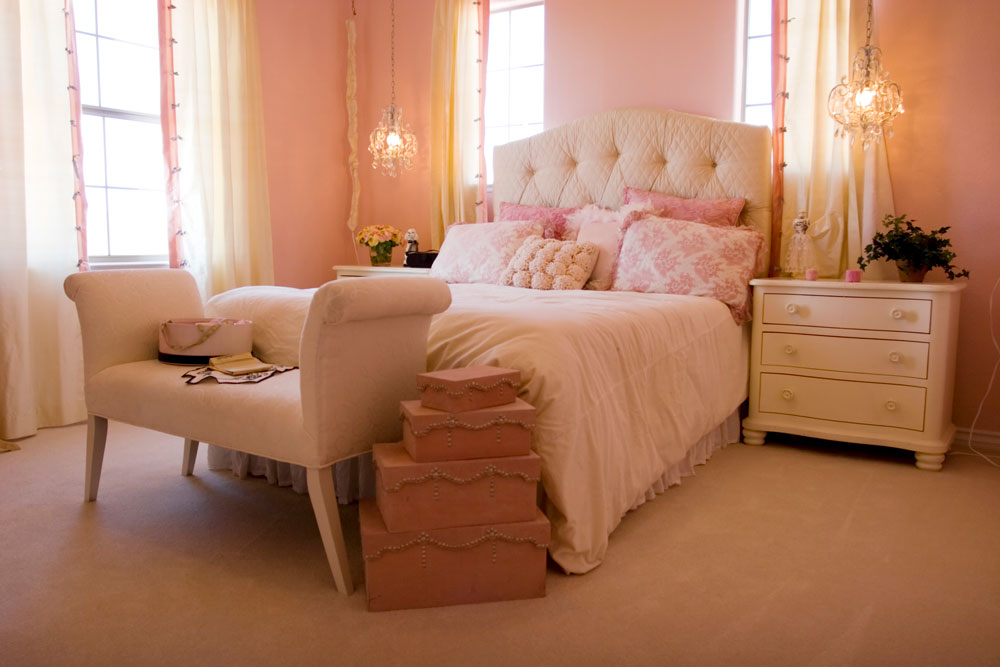 coquette-bedroom with pink walls and chandelier