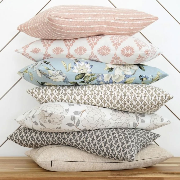 stack of beautiful toss pillows from land of pillows