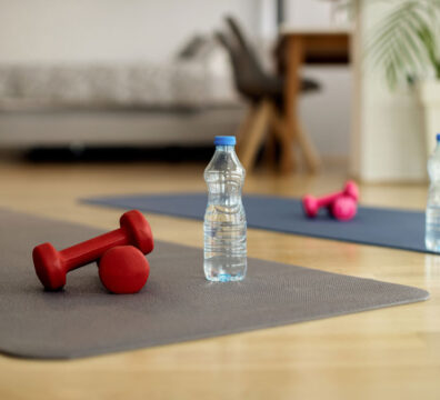 two yoga mats with weights and water